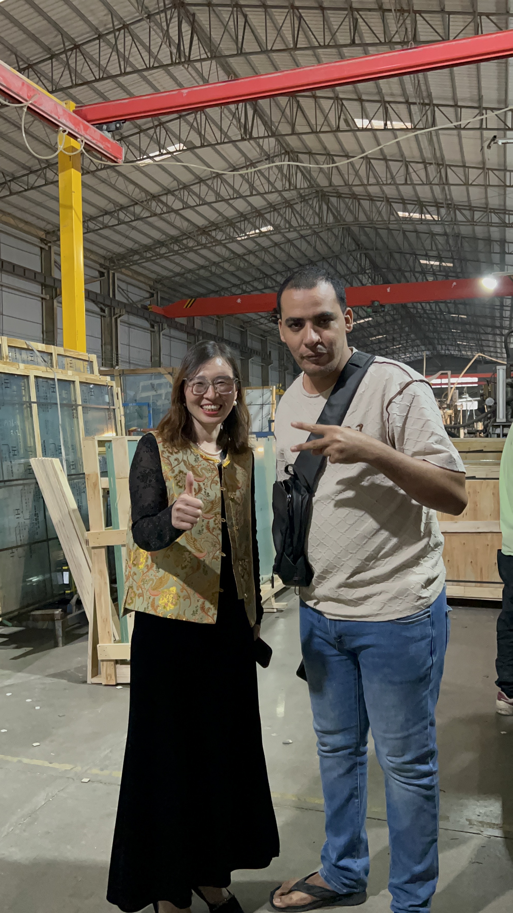 Client touring BDGLASS factory floor with production team